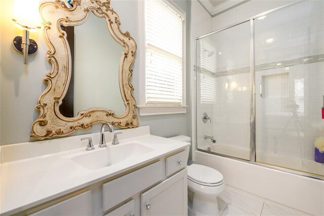 bedroom featuring hardwood / wood-style flooring, crown molding, and ensuite bath