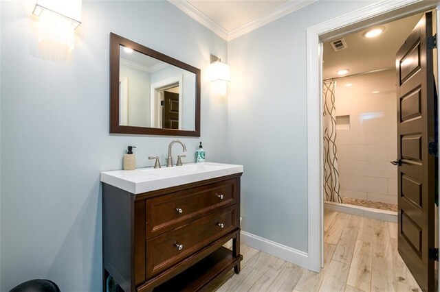 bathroom with crown molding, a shower with curtain, toilet, and hardwood / wood-style flooring