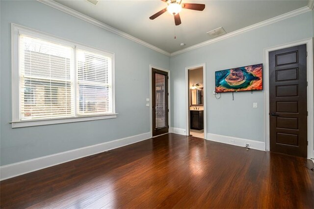 bedroom featuring crown molding, ceiling fan, dark hardwood / wood-style flooring, and ensuite bath