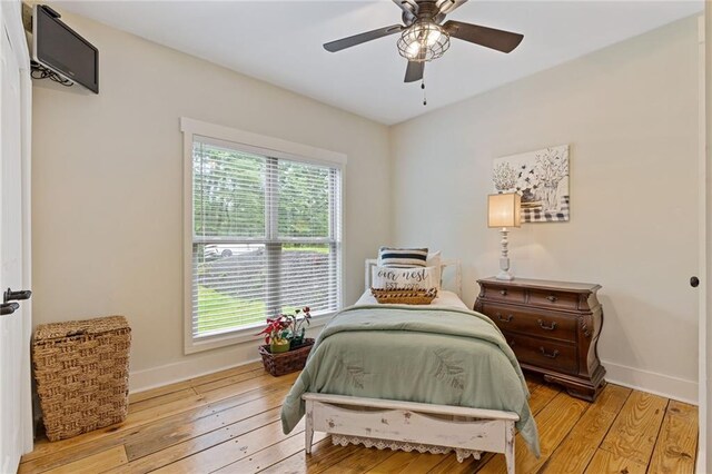 6224 Eagle Ct, Gainesville, GA 30506 - bedroom with light wood-style flooring, baseboards, and a wall unit AC
