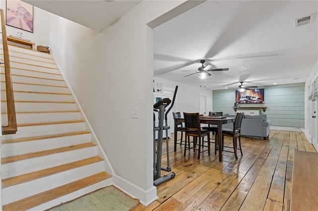 6224 Eagle Ct, Gainesville, GA 30506 - dining room with ceiling fan, hardwood / wood-style floors, stairway, and baseboards