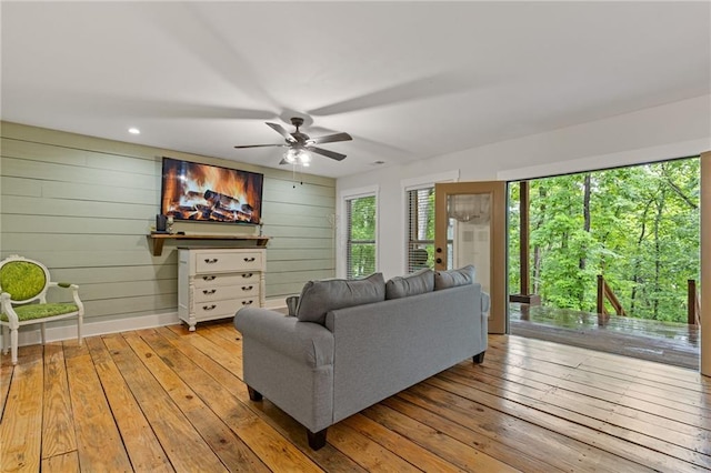 6224 Eagle Ct, Gainesville, GA 30506 - living area featuring hardwood / wood-style flooring, a ceiling fan, and wood walls
