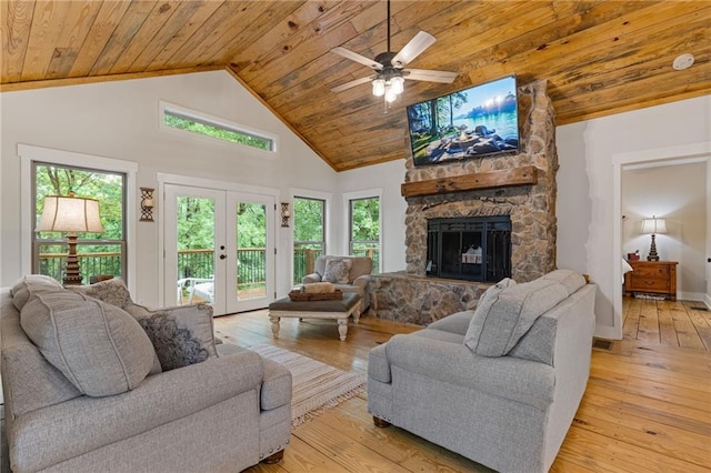 6224 Eagle Ct, Gainesville, GA 30506 - living room featuring wooden ceiling, light wood-type flooring, a stone fireplace, high vaulted ceiling, and a ceiling fan