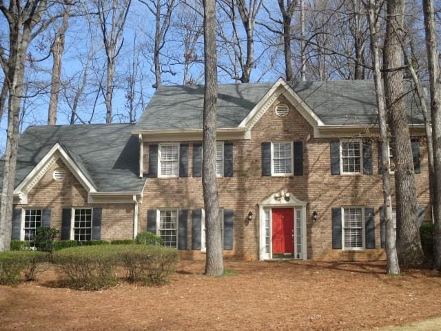 colonial house with brick siding