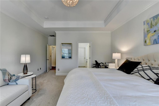 bedroom featuring carpet floors, ornamental molding, and a raised ceiling