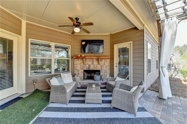 view of patio with ceiling fan and an outdoor living space