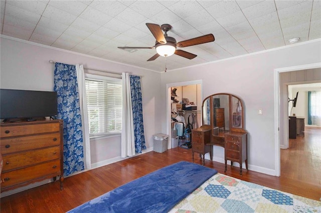 108 Buena St, Bremen, GA 30110 - bedroom featuring ornamental molding, wood finished floors, a spacious closet, a closet, and ceiling fan