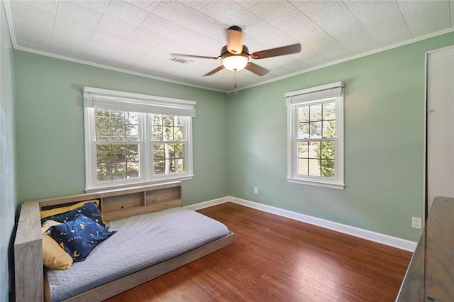 108 Buena St, Bremen, GA 30110 - bedroom featuring crown molding, multiple windows, wood finished floors, and a ceiling fan