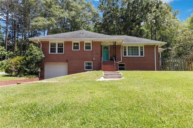 108 Buena St, Bremen, GA 30110 - tri-level home featuring an attached garage, brick siding, and driveway