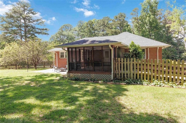108 Buena St, Bremen, GA 30110 - back of property with a sunroom, a patio area, and brick siding