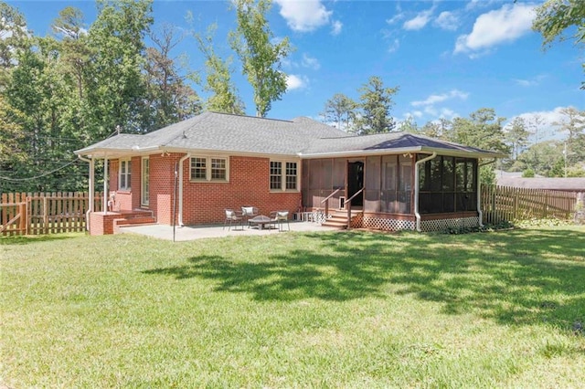 108 Buena St, Bremen, GA 30110 - rear view of house with a sunroom, a patio, a fenced backyard, and brick siding