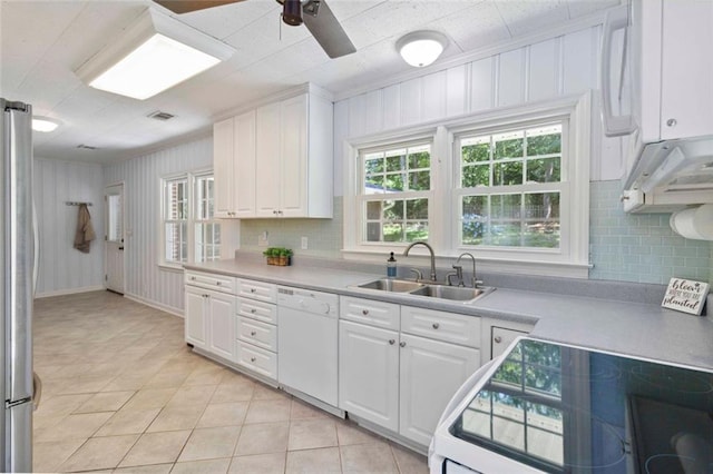 108 Buena St, Bremen, GA 30110 - kitchen with white dishwasher, freestanding refrigerator, light tile patterned floors, tasteful backsplash, and white cabinets