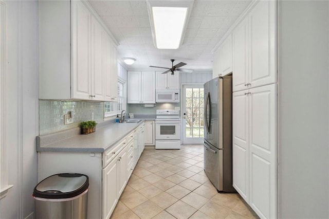 108 Buena St, Bremen, GA 30110 - kitchen featuring white appliances, white cabinets, a ceiling fan, light countertops, and tasteful backsplash