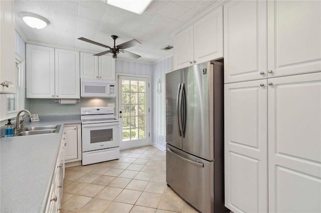 108 Buena St, Bremen, GA 30110 - kitchen with white appliances, white cabinets, light tile patterned floors, a ceiling fan, and light countertops