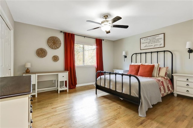 bedroom featuring a closet, light hardwood / wood-style flooring, and ceiling fan