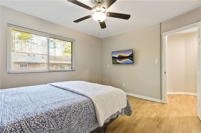 bedroom featuring ceiling fan and light hardwood / wood-style flooring