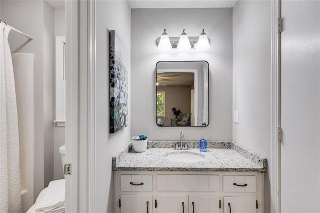 bathroom with vanity and shower / tub combo with curtain