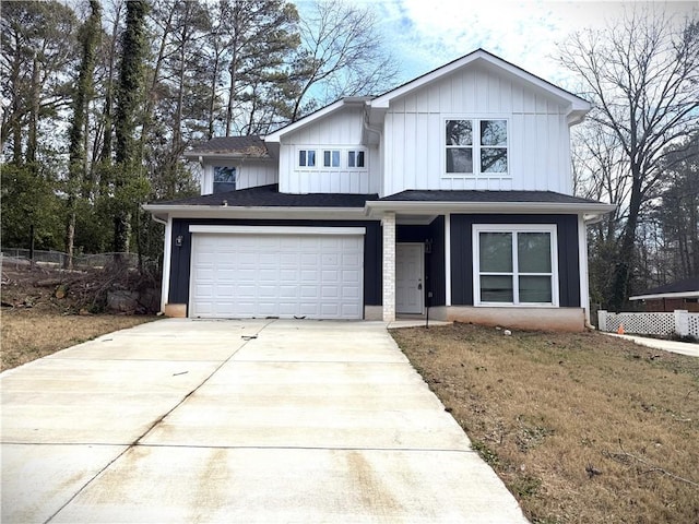 view of front of home with a garage and a front yard