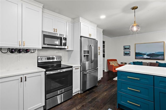 261 Lamplighter Ln SE, Marietta, GA 30067 - kitchen with stainless steel appliances, blue cabinets, light countertops, dark wood-style floors, and ornamental molding