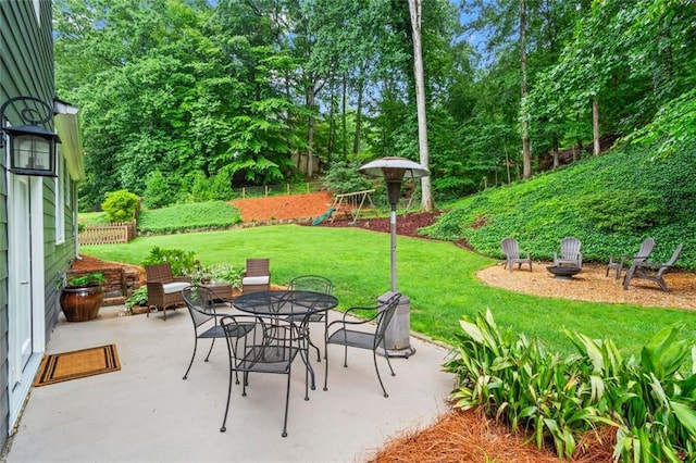 261 Lamplighter Ln SE, Marietta, GA 30067 - view of patio with a playground, an outdoor fire pit, and outdoor dining space