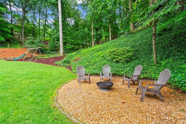 261 Lamplighter Ln SE, Marietta, GA 30067 - view of grassy yard featuring an outdoor fire pit