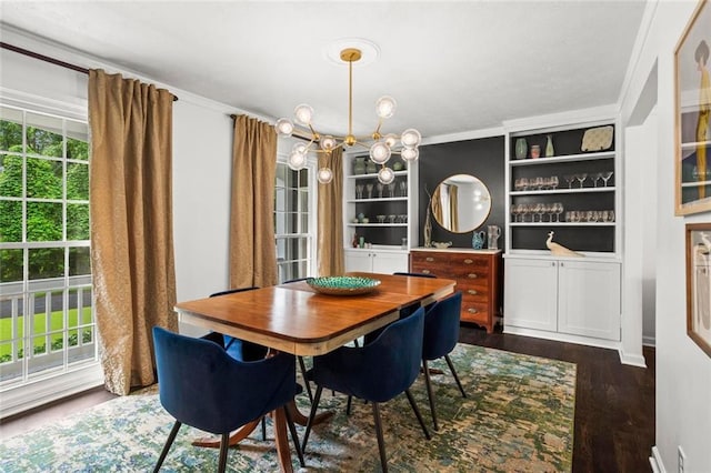 261 Lamplighter Ln SE, Marietta, GA 30067 - dining space featuring crown molding, dark wood finished floors, built in features, and a chandelier