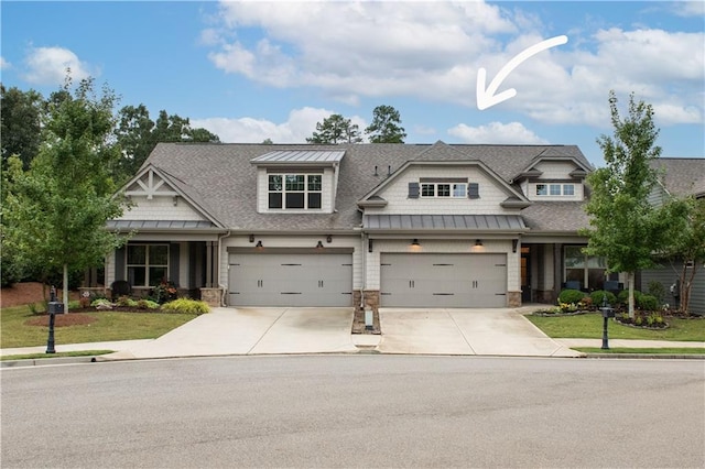 craftsman-style house with a front lawn and a garage