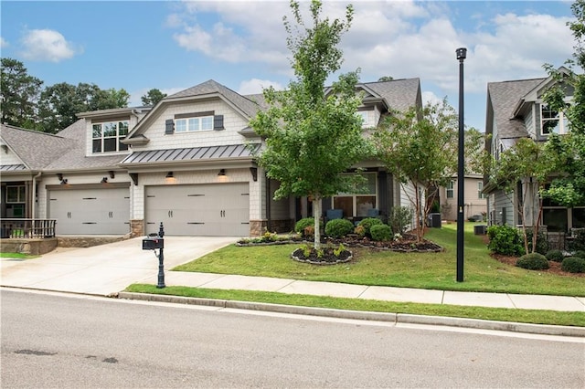 craftsman-style home featuring a front lawn and a garage