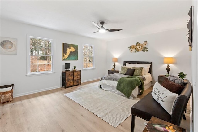 bedroom featuring ceiling fan and light hardwood / wood-style floors