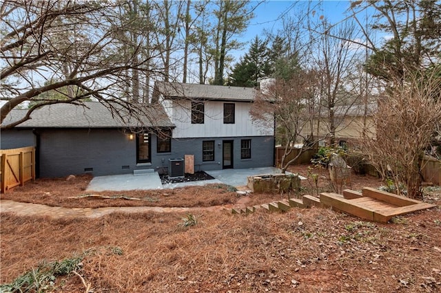 rear view of property featuring central AC unit and a patio