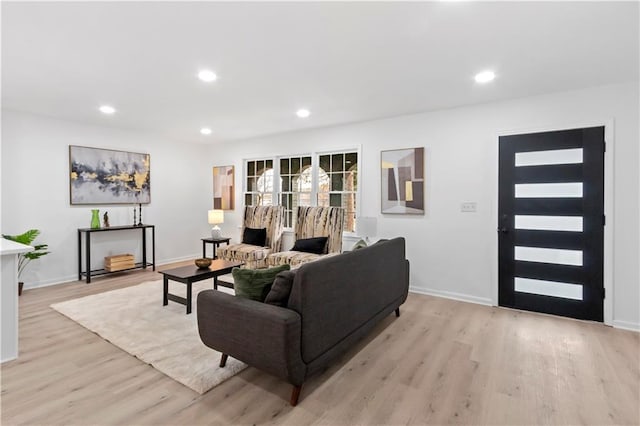 living room with light hardwood / wood-style flooring