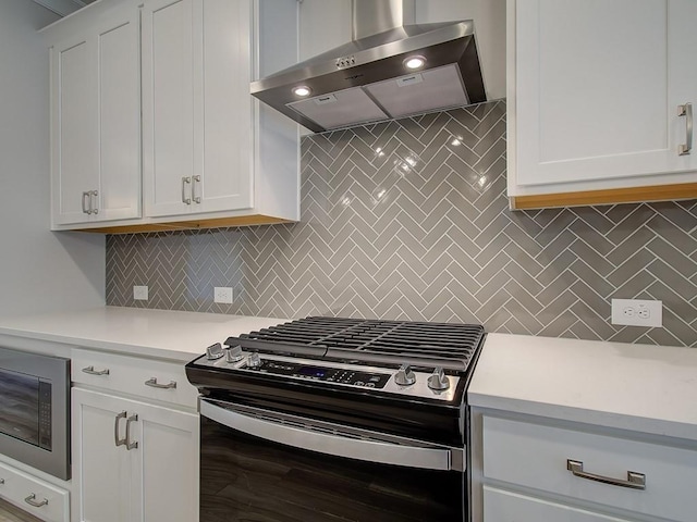 1976 Deco Dr, Kennesaw, GA 30144 - kitchen featuring wall chimney range hood, light countertops, stainless steel gas range oven, and built in microwave