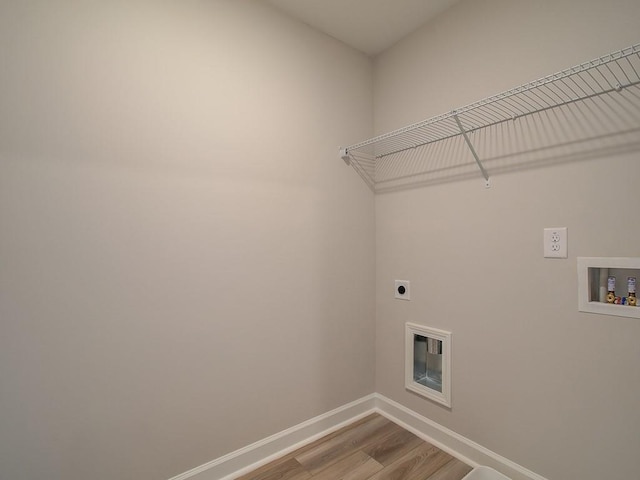 1976 Deco Dr, Kennesaw, GA 30144 - laundry area with laundry area, electric dryer hookup, wood finished floors, baseboards, and hookup for a washing machine