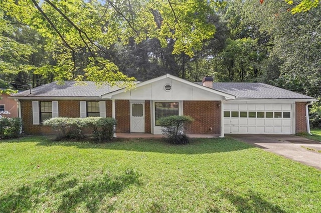 ranch-style house featuring a front lawn and a garage