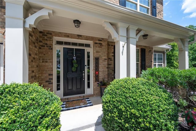 entrance to property featuring a porch