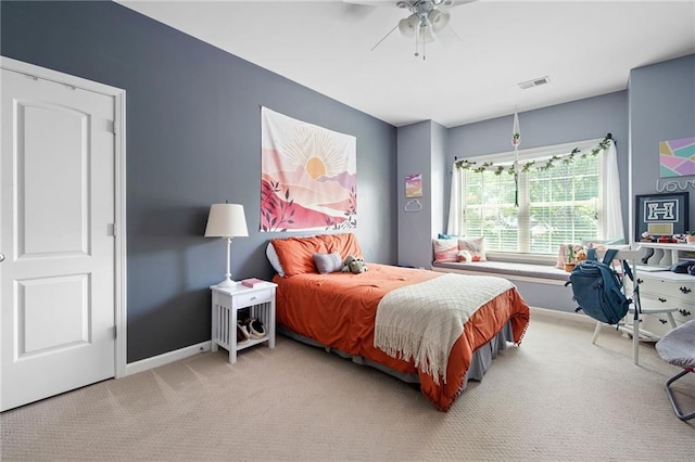 carpeted bedroom featuring ceiling fan