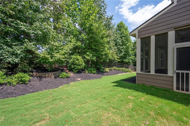 view of yard with a sunroom