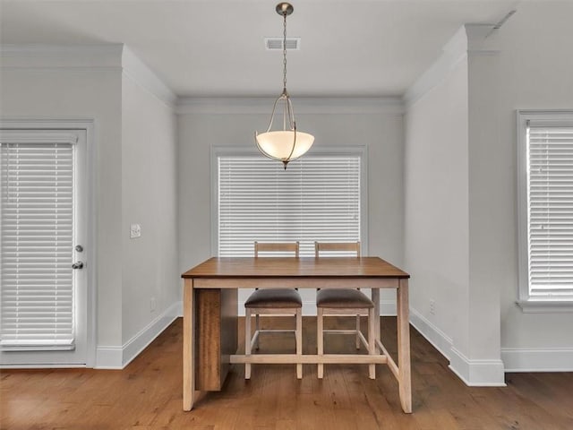 105 Lighthouse Cv SW, Adairsville, GA 30103 - dining space featuring wood finished floors and crown molding