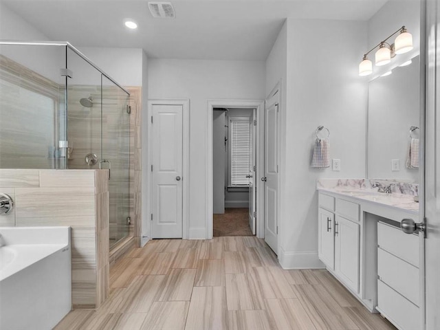 105 Lighthouse Cv SW, Adairsville, GA 30103 - full bath featuring a stall shower, vanity, a garden tub, and recessed lighting