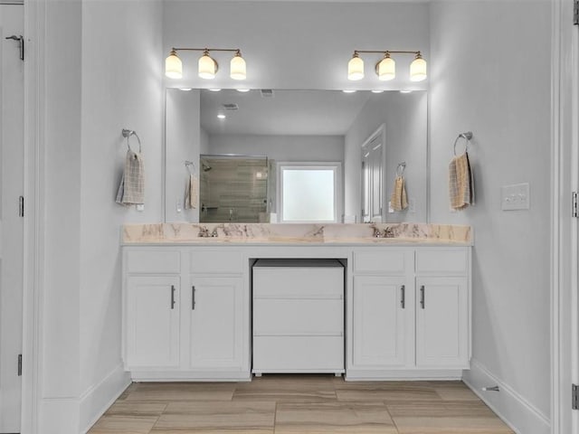 105 Lighthouse Cv SW, Adairsville, GA 30103 - full bath with double vanity, a shower stall, and wood finished floors