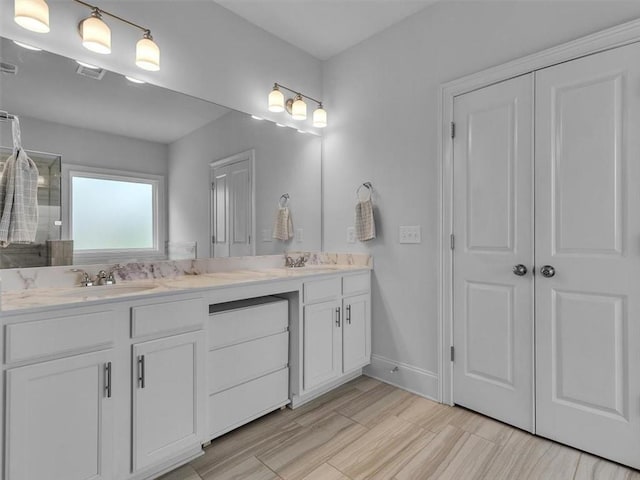 105 Lighthouse Cv SW, Adairsville, GA 30103 - bathroom featuring double vanity, a tile shower, and wood finished floors