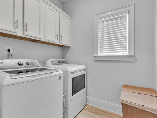 105 Lighthouse Cv SW, Adairsville, GA 30103 - laundry area with washer and dryer, light wood-type flooring, and cabinet space