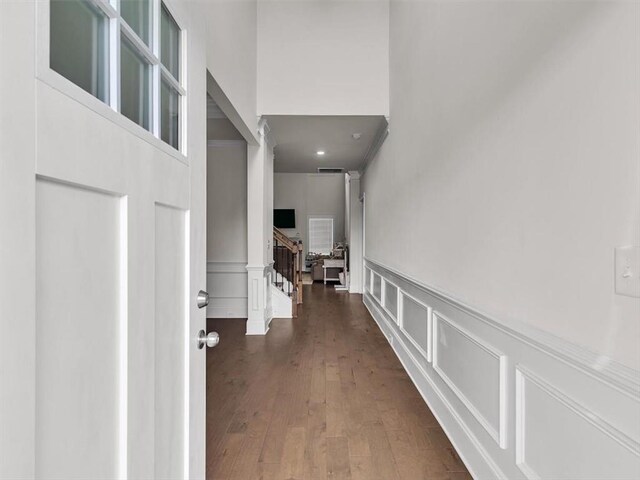 105 Lighthouse Cv SW, Adairsville, GA 30103 - hallway with a decorative wall, wainscoting, wood-type flooring, stairs, and recessed lighting