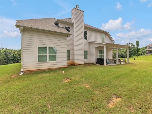 105 Lighthouse Cv SW, Adairsville, GA 30103 - rear view of property featuring a patio, a chimney, a yard, and roof with shingles
