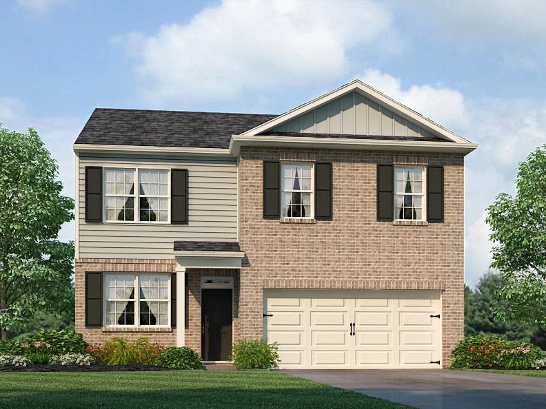 view of front of home featuring a garage and a front yard