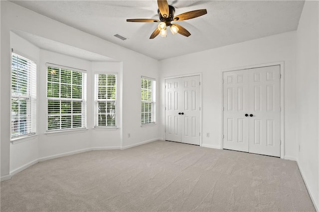 4044 Spring Cove Dr, Duluth, GA 30097 - unfurnished bedroom featuring carpet, two closets, and baseboards