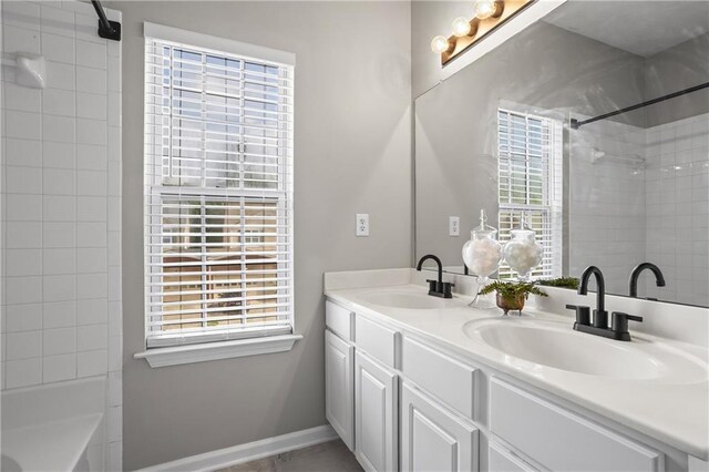 4044 Spring Cove Dr, Duluth, GA 30097 - full bath with double vanity, plenty of natural light, and tub / shower combination