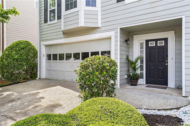 4044 Spring Cove Dr, Duluth, GA 30097 - view of exterior entry with a garage and concrete driveway