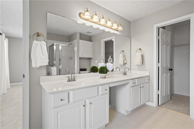 4044 Spring Cove Dr, Duluth, GA 30097 - bathroom with double vanity, a stall shower, tile patterned floors, and baseboards