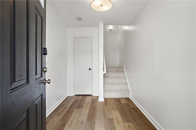 4044 Spring Cove Dr, Duluth, GA 30097 - foyer entrance featuring baseboards, dark wood finished floors, and stairs